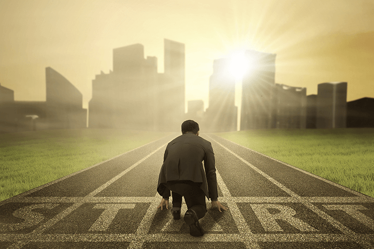 man kneeling on the a start sign